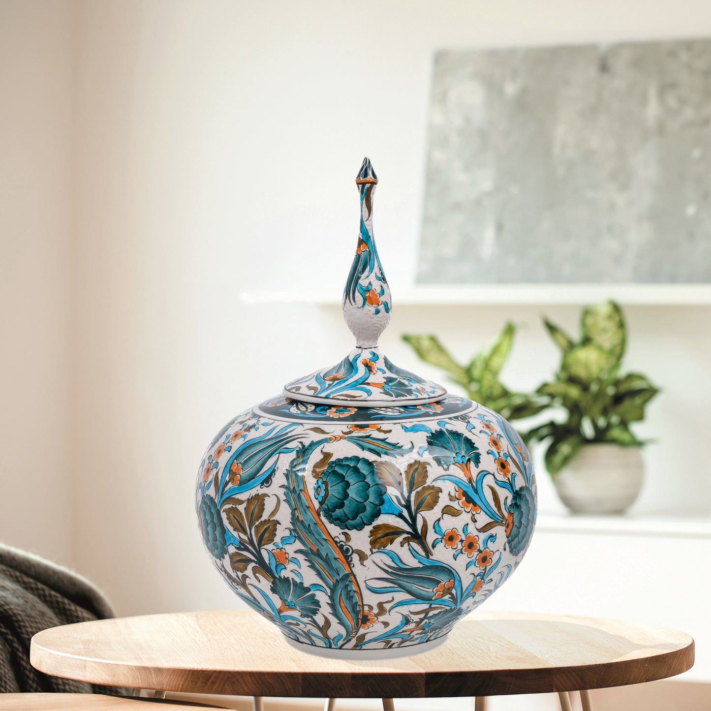 Hand-painted Iznik Bloom globe jar with teal blooms, tulips & vines on white. Bulbous Ottoman-inspired ceramic jar with finial lid, perfect décor or gift.