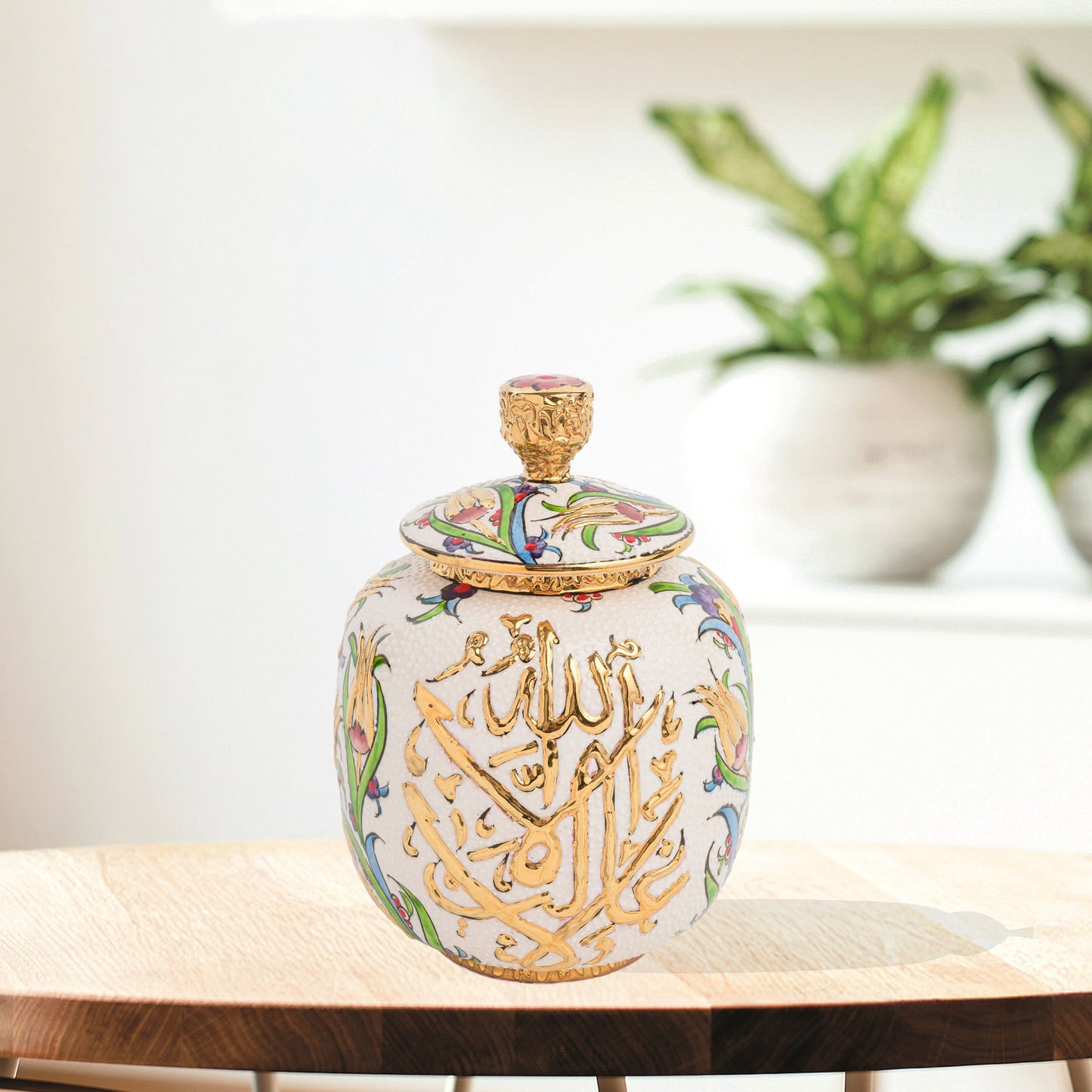 Hand-painted Divine Script ceramic jar with golden Arabic calligraphy and floral motifs. Lidded artisan jar, perfect for honey, ginger, spices, or spiritual décor.