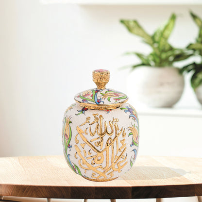 Hand-painted Divine Script ceramic jar with golden Arabic calligraphy and floral motifs. Lidded artisan jar, perfect for honey, ginger, spices, or spiritual décor.