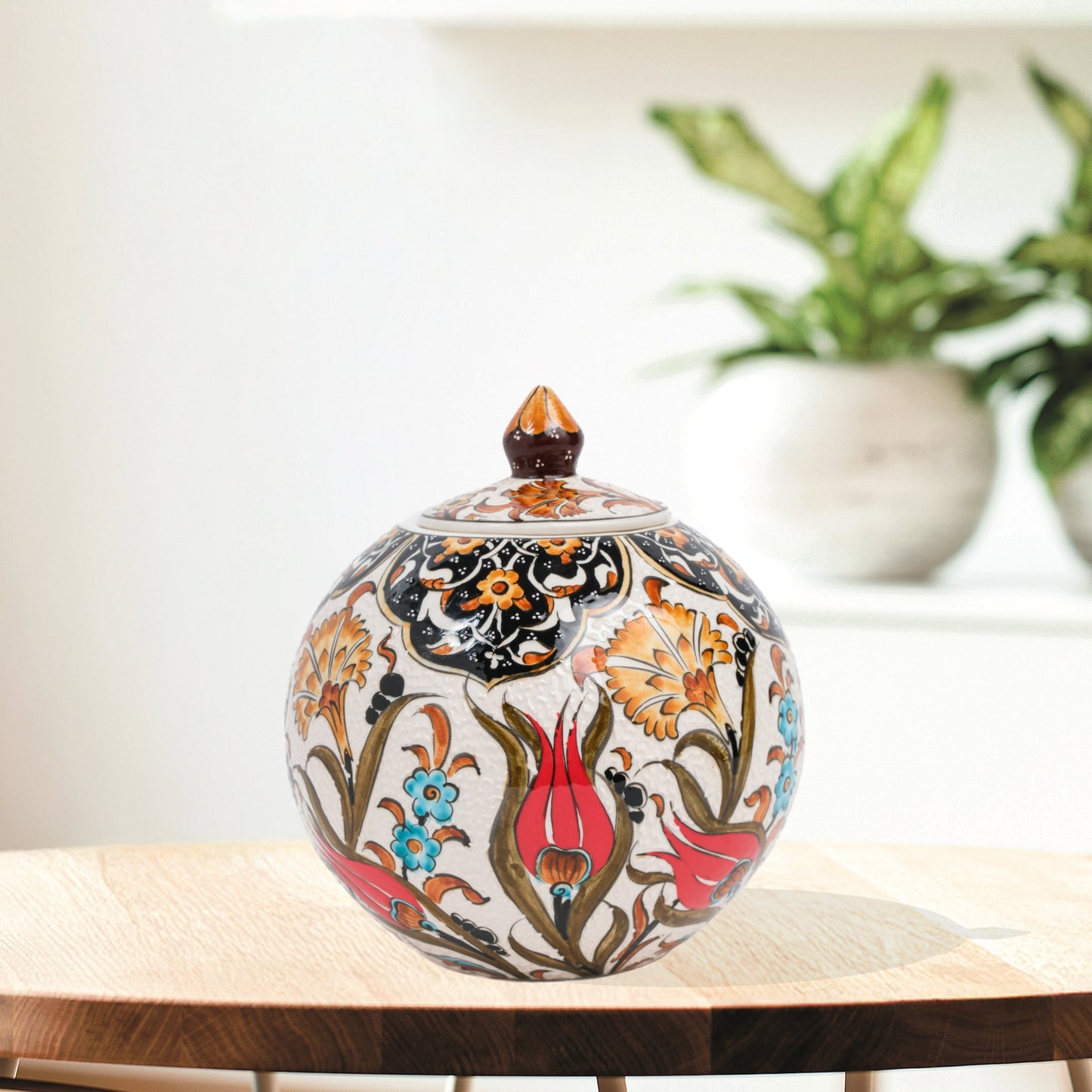 Hand-painted Red Tulip globe jar with Ottoman floral motifs in red, blue & gold. Glossy round ceramic jar, artisan-crafted, perfect décor or thoughtful gift.