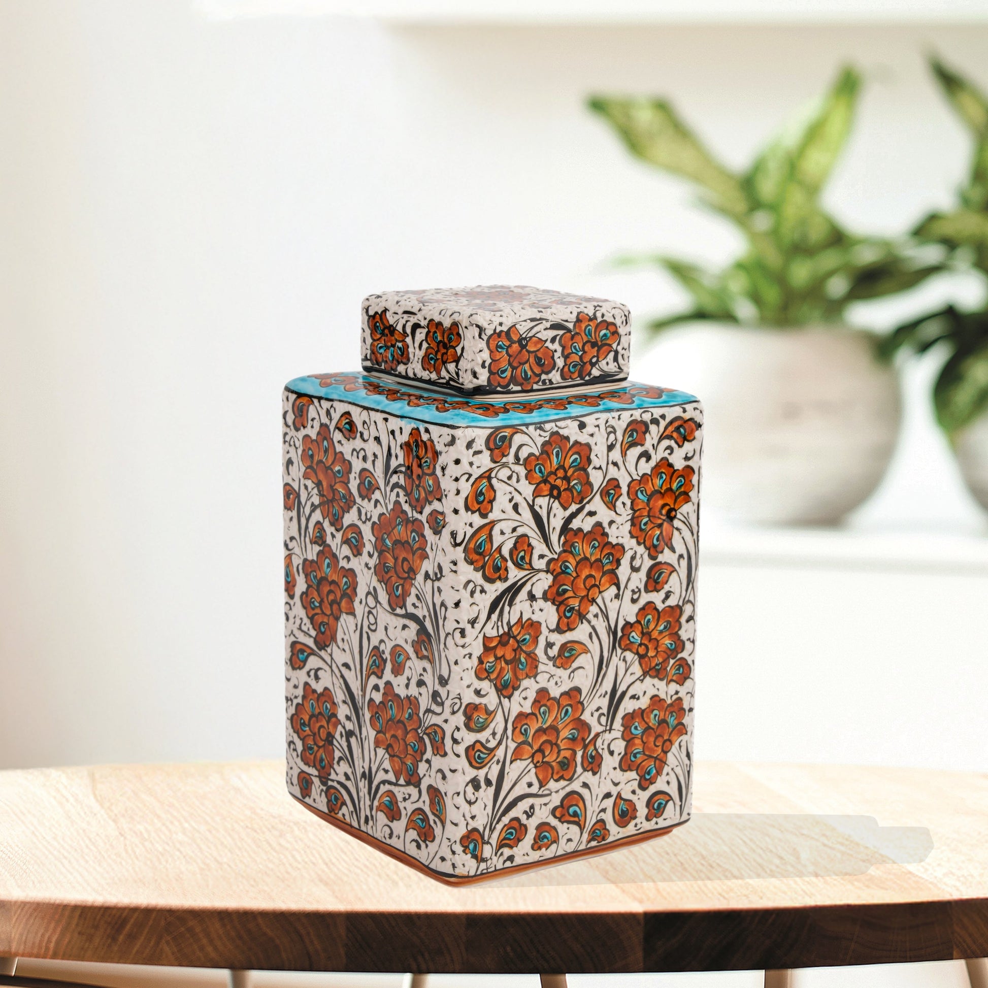 Hand-painted Terracotta Bloom ceramic jar with vivid orange floral motifs. Square lidded design, artisan-crafted, perfect for tea, spices, décor, or gifts.