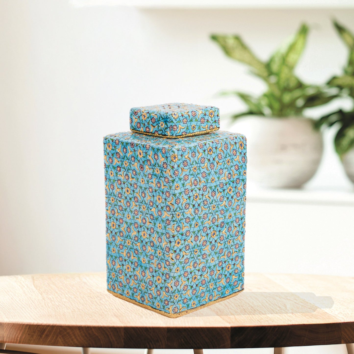 Hand-painted Golden Blossom ceramic jar with turquoise base and gold floral motifs. Square lidded design, artisan-made, perfect for décor, tea, or gifts.