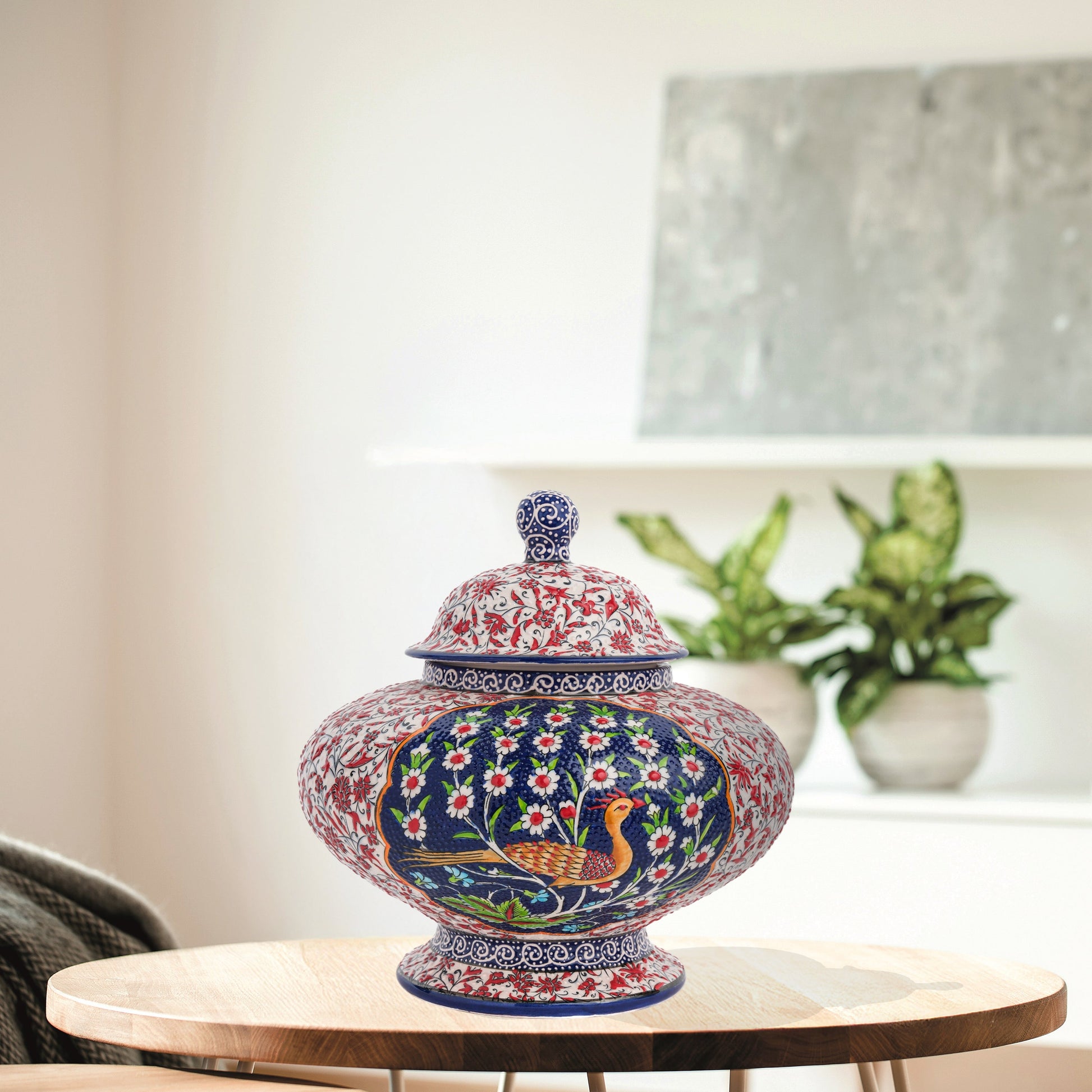 Hand-painted Songbird Bloom ceramic jar with bird and daisy motifs in navy, red & green. Wide artisan jar, glossy glazed, perfect décor accent or gift.