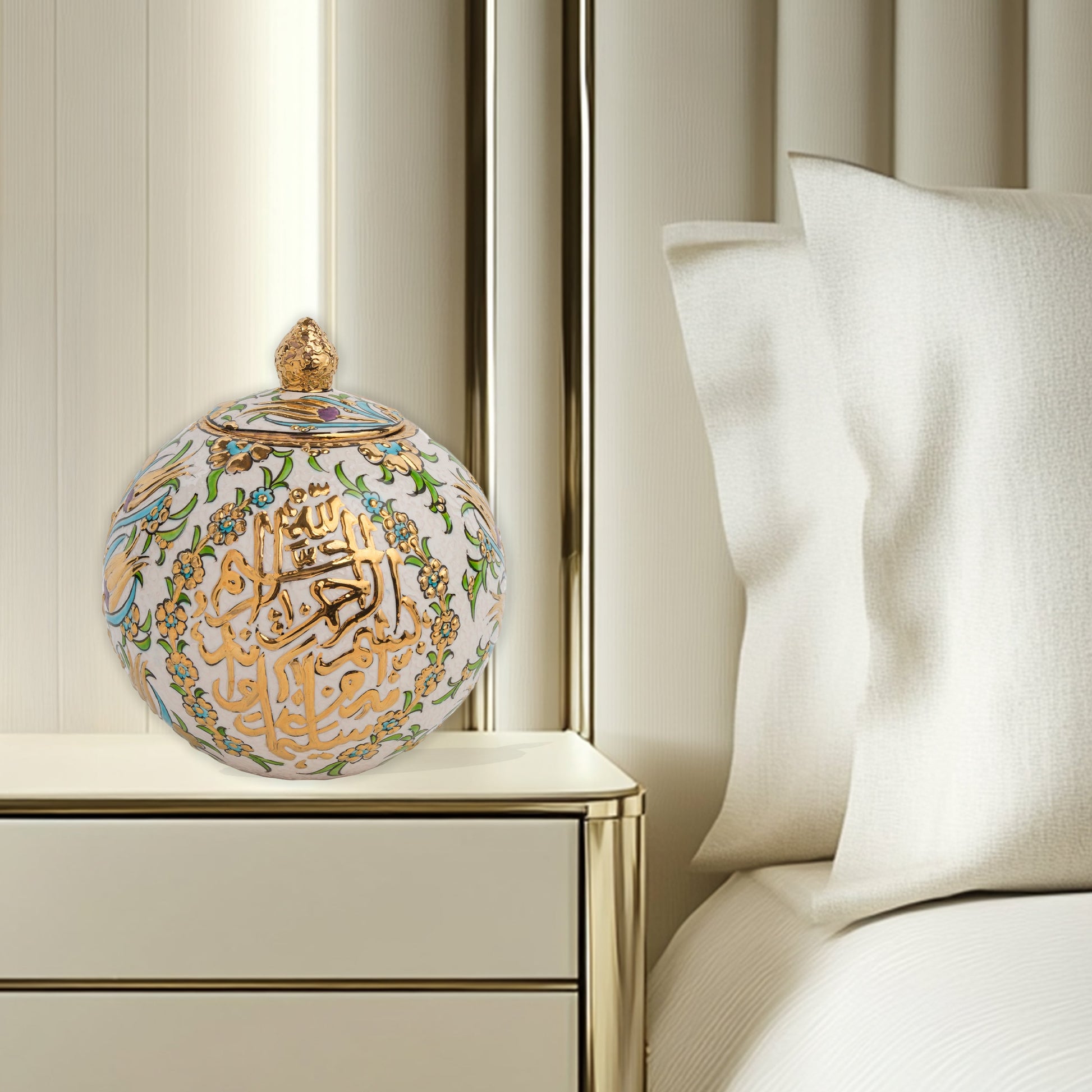 Hand-painted Floral Script globe jar with golden Arabic calligraphy and turquoise floral motifs. Spherical ceramic design, artisan-made, perfect décor or gift.