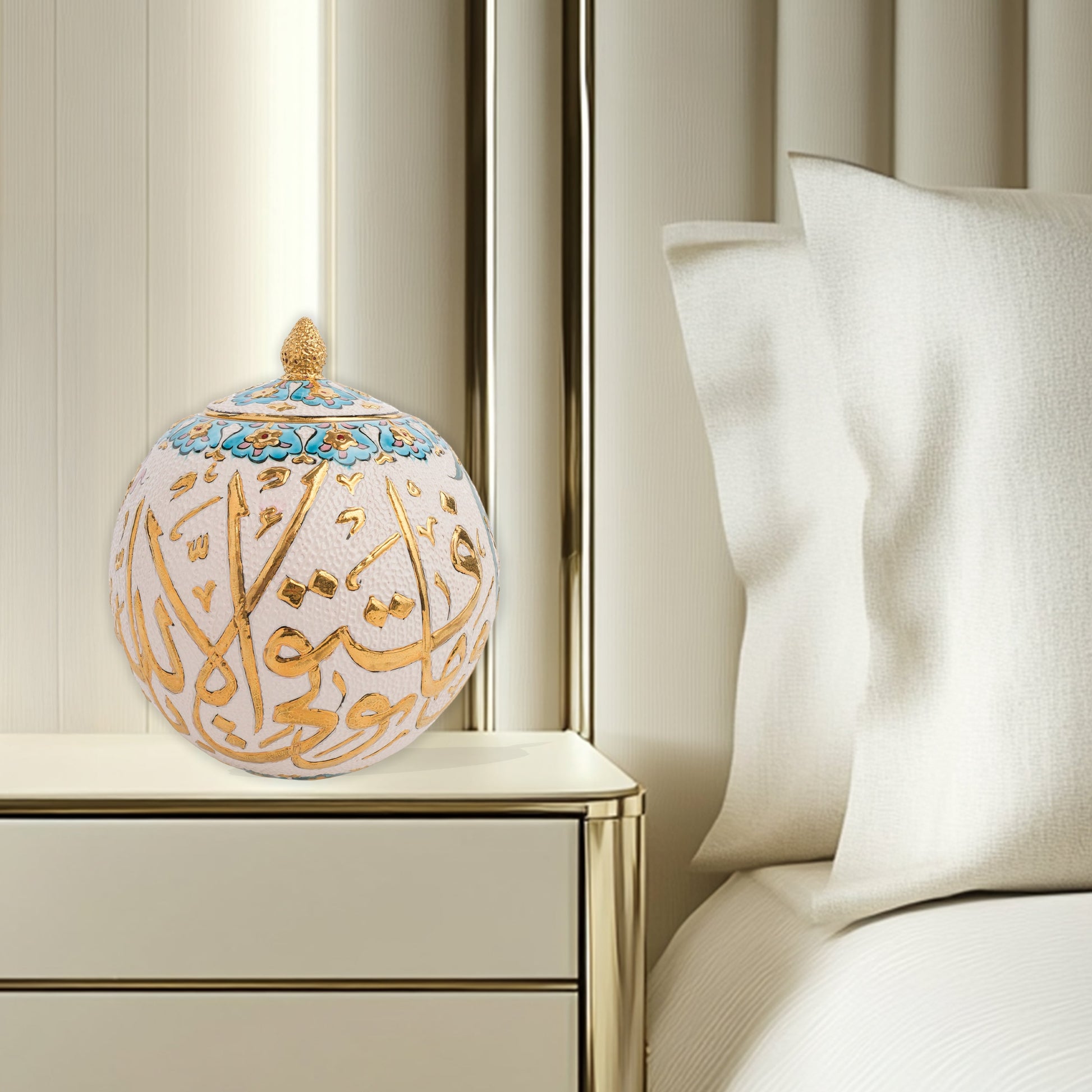 Hand-painted Gold Script globe jar with Arabic calligraphy in gold and turquoise floral trim. Spherical ceramic jar with gilded finial, perfect décor or gift.