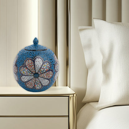 Hand-painted Blue Blossom globe jar with layered floral motifs and raised blue scrollwork. Spherical ceramic jar, artisan-made, perfect décor or gift.