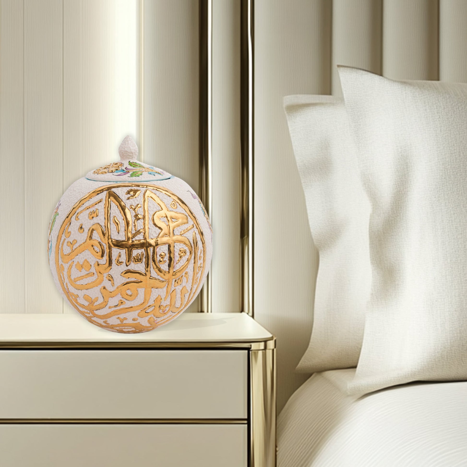 Hand-painted Gold Script globe jar with Arabic calligraphy and turquoise floral motifs. Spherical ceramic design with gold finial, perfect décor or gift.