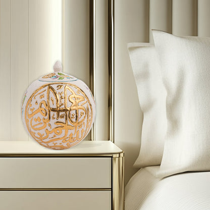 Hand-painted Gold Script globe jar with Arabic calligraphy and turquoise floral motifs. Spherical ceramic design with gold finial, perfect décor or gift.