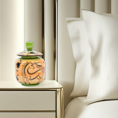 Hand-painted Unicorn Dance ceramic jar with whimsical black unicorn motif on orange & green. Lidded artisan jar, perfect for honey, ginger, spices, or décor.
