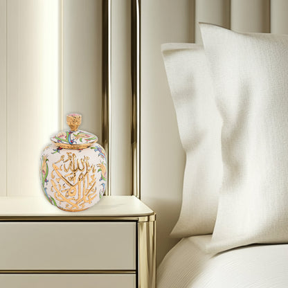 Hand-painted Divine Script ceramic jar with golden Arabic calligraphy and floral motifs. Lidded artisan jar, perfect for honey, ginger, spices, or spiritual décor.
