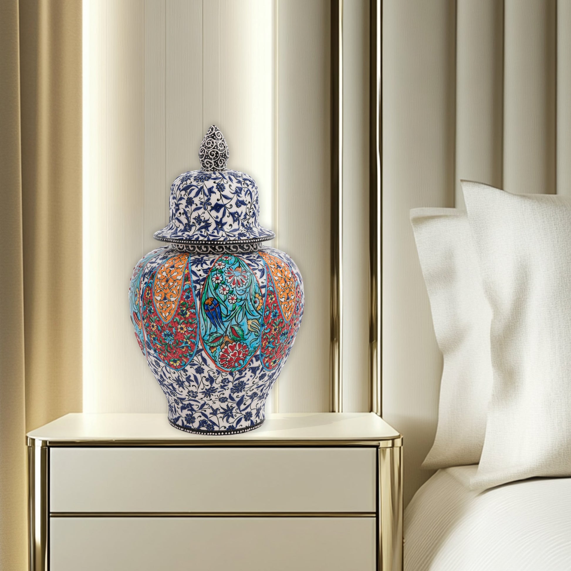 Hand-painted Garden Song ceramic jar with floral and bird motifs in vibrant panels. Lidded artisan jar with ornate finial, perfect décor accent or gift.