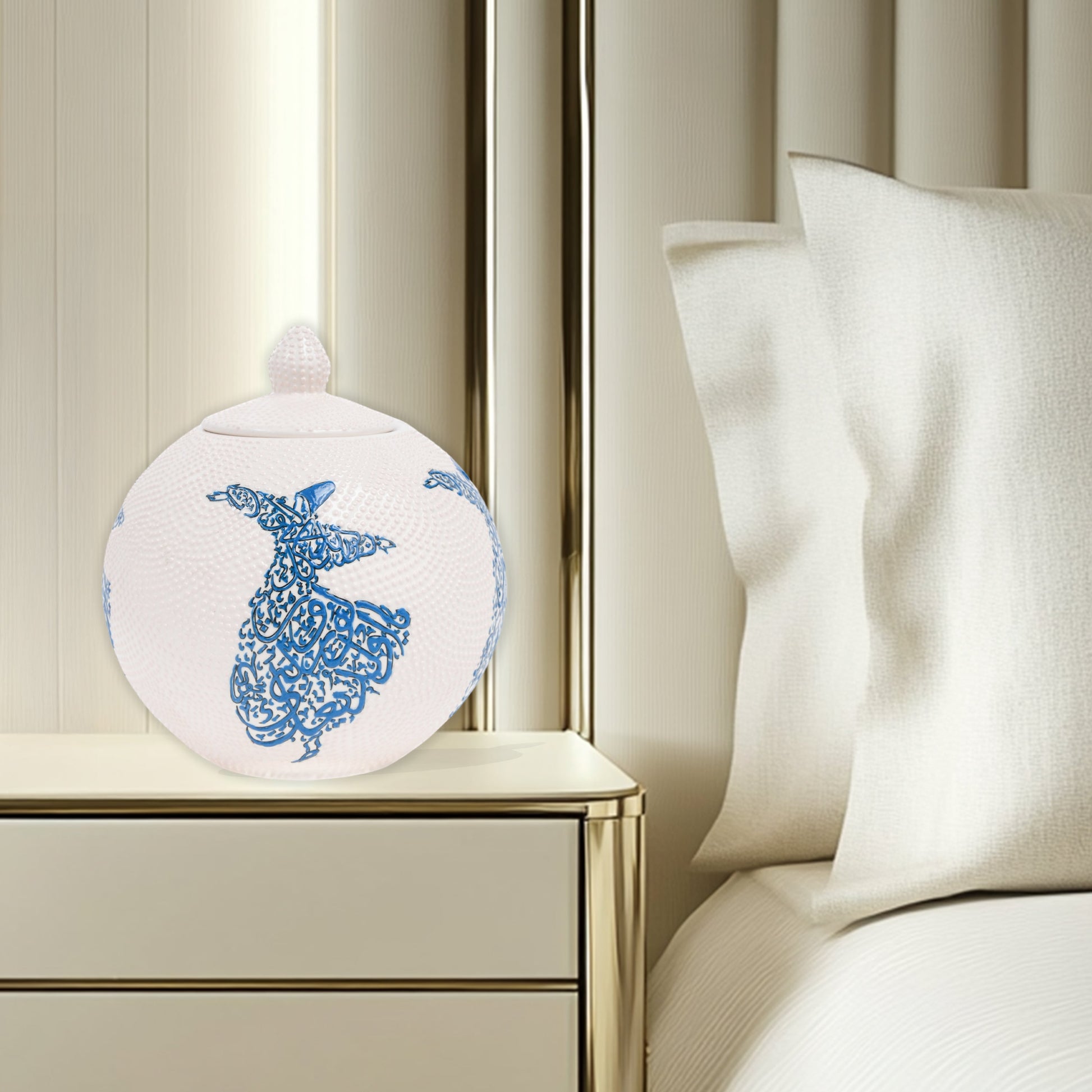 Hand-painted Whirling Dervish globe jar with Arabic calligraphy design. Available in blue or red, this ceramic round jar is perfect for spiritual décor or gifts.