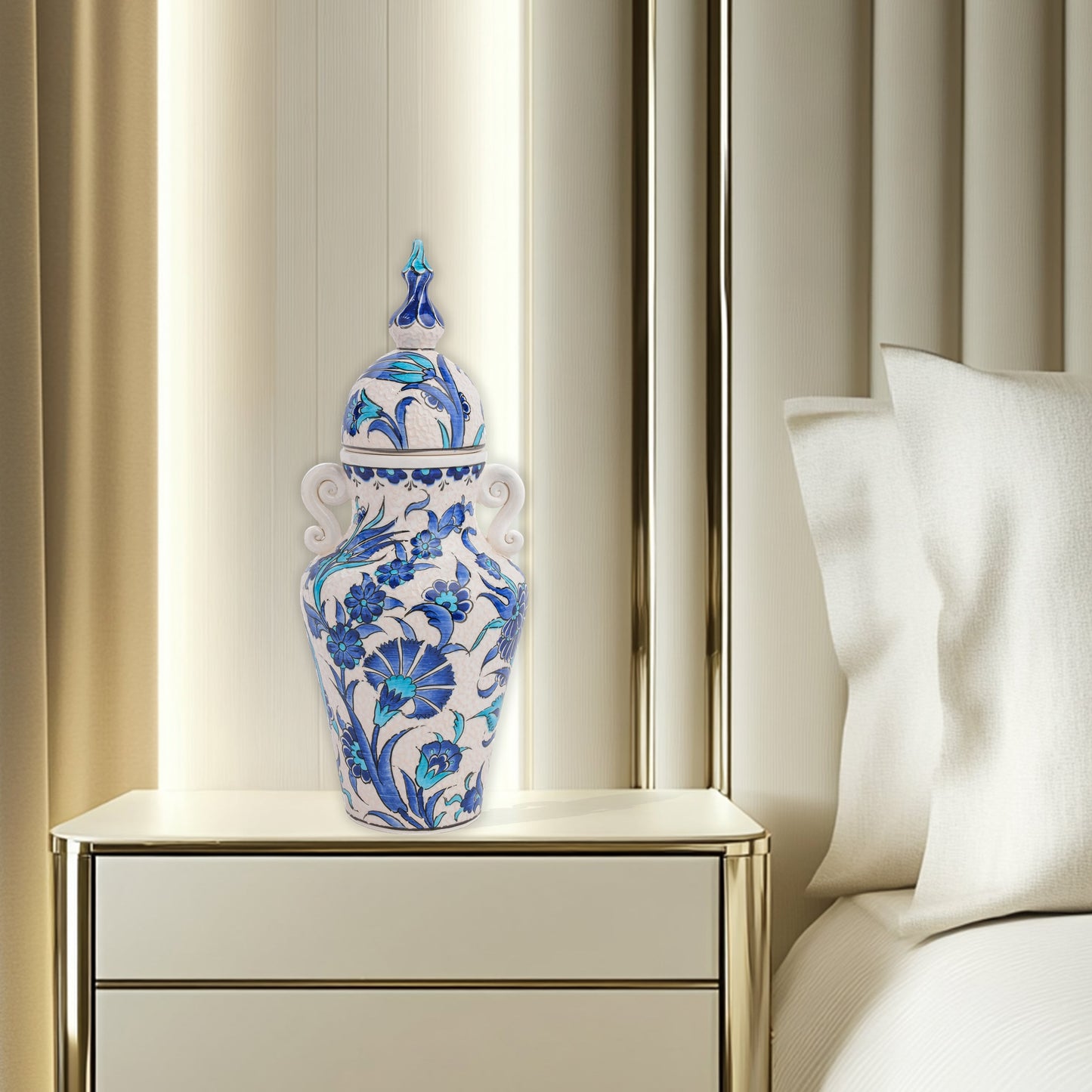 Hand-painted Azure Blossom ceramic jar with Turkish blue floral motifs and turquoise accents. Features handles and finial lid, perfect décor or collector’s gift.