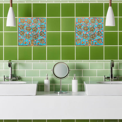 Bathroom with green tiles and decorative ceramic tile above a sink.