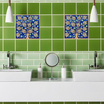 Bathroom with green tiles and decorative ceramic tiles above a sink.