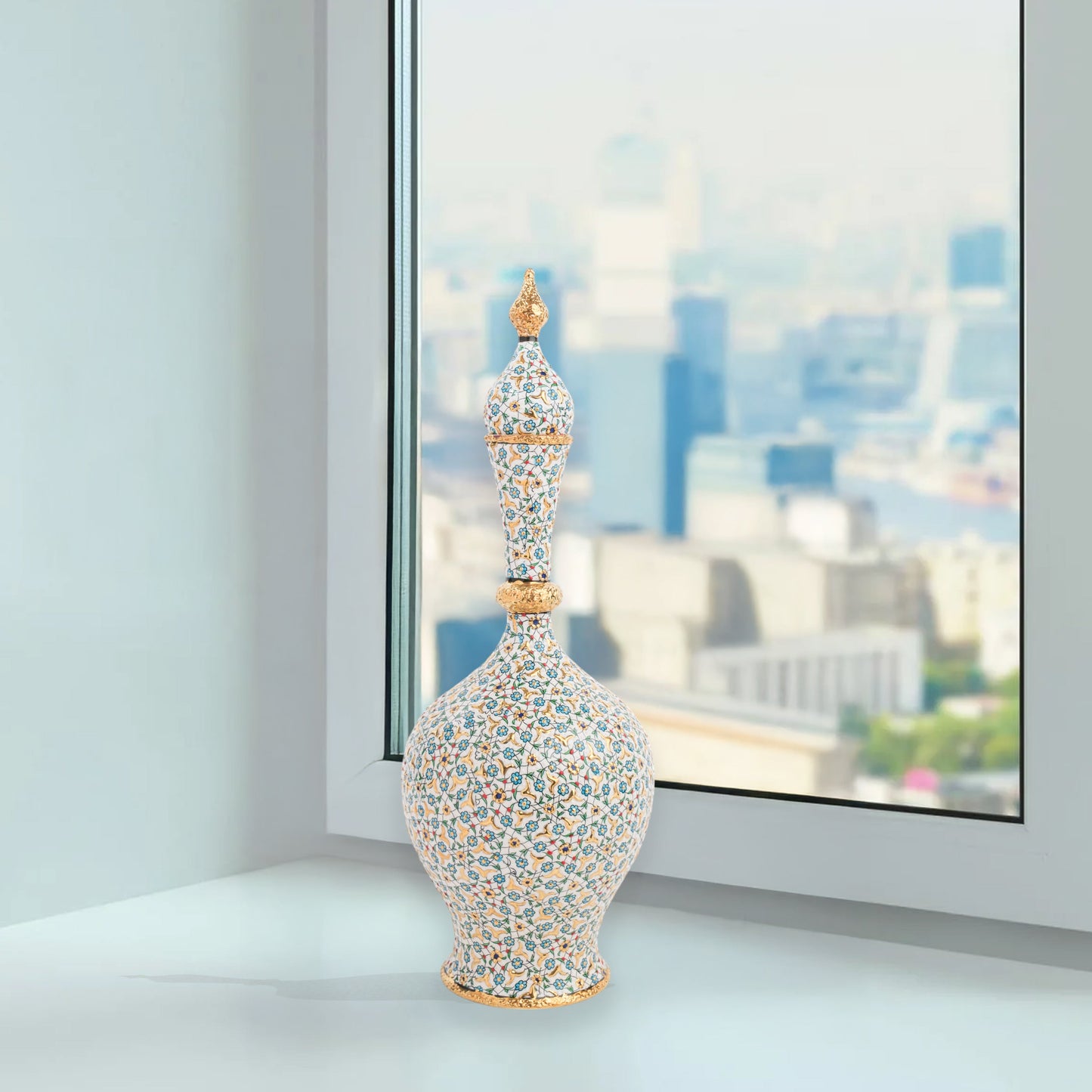 Hand-painted ceramic decorative bottle with turquoise floral motifs and golden details. Minaret-inspired shape with spire lid, perfect for décor or gifting.