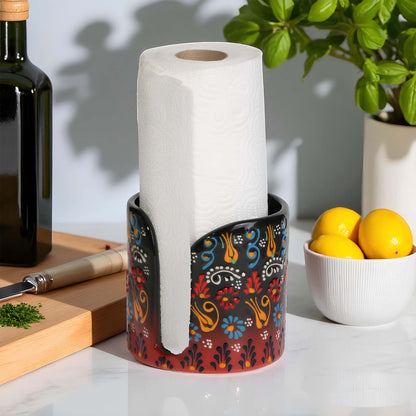 Decorative paper towel holder with a roll of paper towels on a kitchen counter.