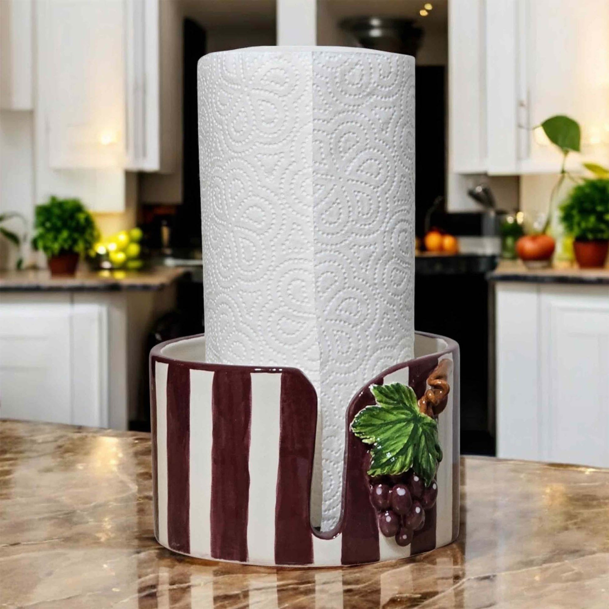 Decorative paper towel holder with grapes on a kitchen counter