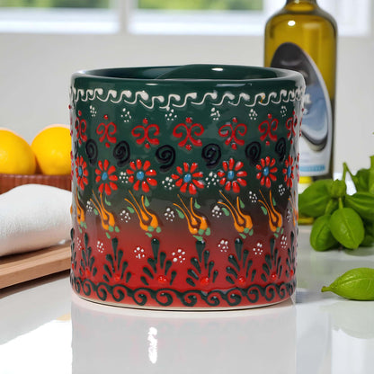 Decorative ceramic paper towel holder with floral patterns on a kitchen counter