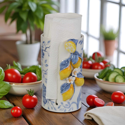 Decorative paper towel holder with lemon design on a kitchen counter with vegetables.