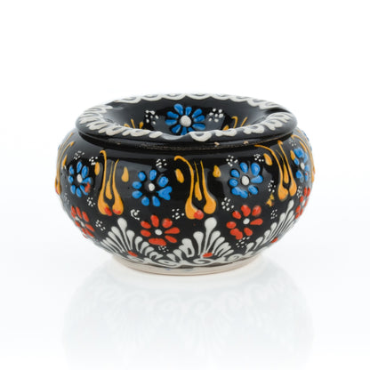Decorative ceramic ashtray with colorful floral patterns on a white background