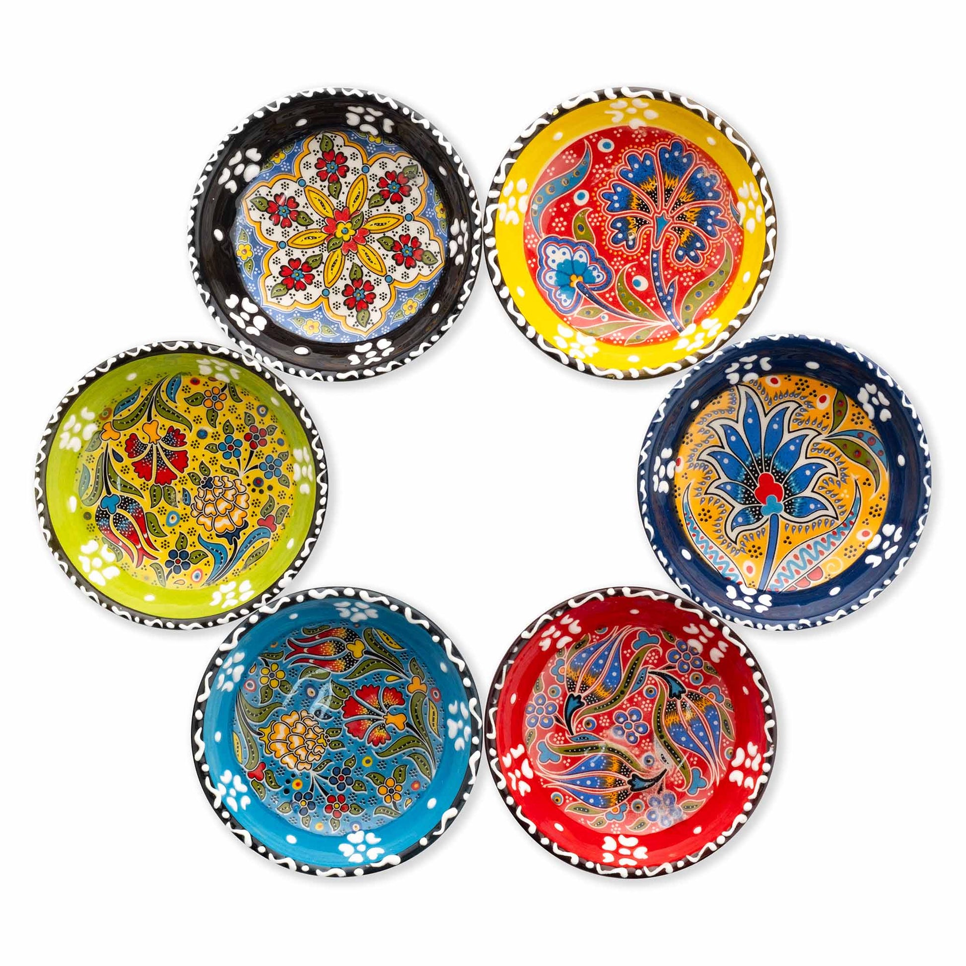 Set of six colorful ceramic bowls with floral patterns on a white background