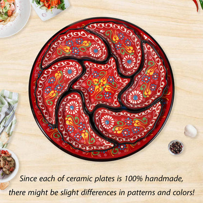 Decorative ceramic snack serving tray set with intricate patterns on a wooden table.