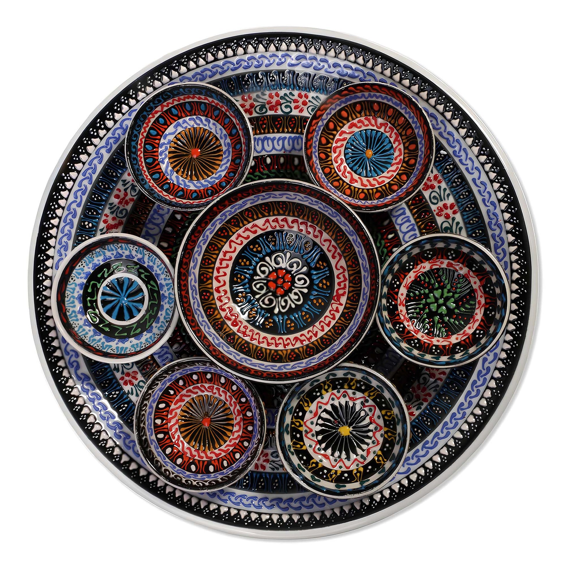 Decorative ceramic plate with colorful circular bowls on a white background