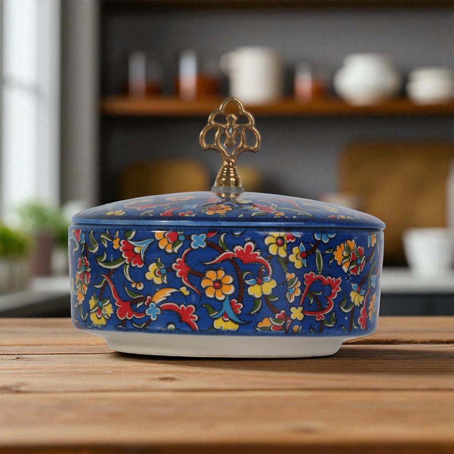 Decorative ceramic sugar bowl with floral patterns on a wooden surface