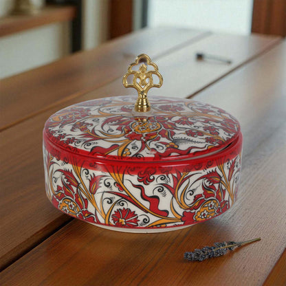 Decorative sugar bowl with intricate patterns on a wooden surface