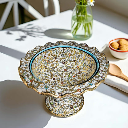 Decorative ceramic sugar bowl with intricate patterns on a white table.