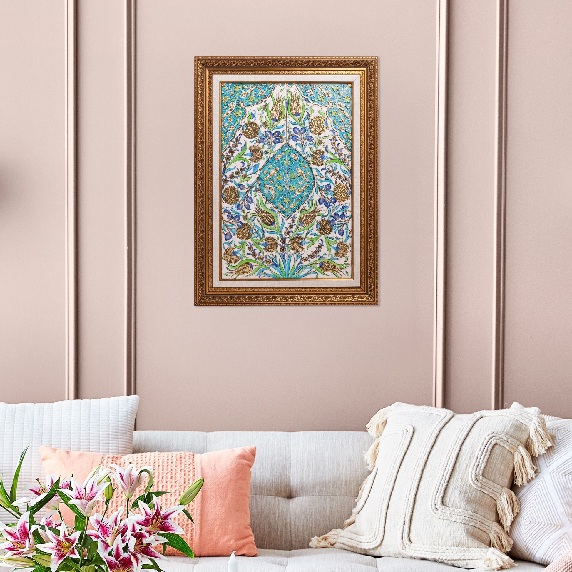 Decorative ceramic tile above a sofa with pink cushions.