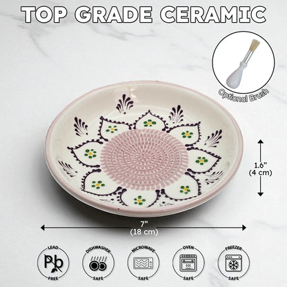 Ceramic garlic grater bowl with decorative patterns and measurements on a white background