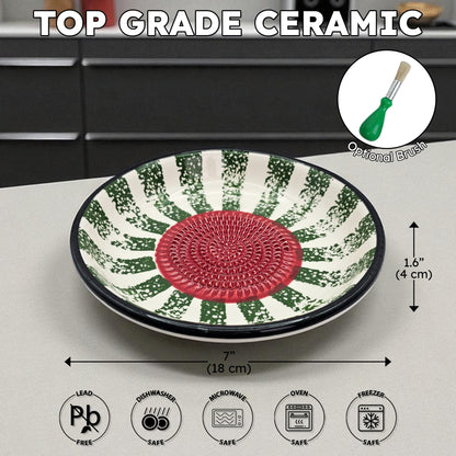 Ceramic garlic grater bowl with green and red pattern on a kitchen counter, labeled as 'Top Grade Ceramic'.