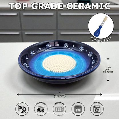Top grade ceramic garlic grater bowl with blue interior and white exterior on a kitchen counter, featuring dimensions and safety icons.