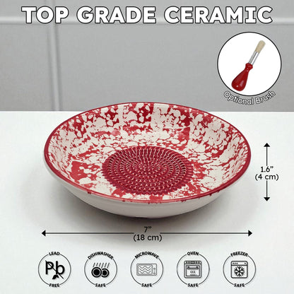 Red and white ceramic garlic grater bowl with measurements and safety icons on a gray background