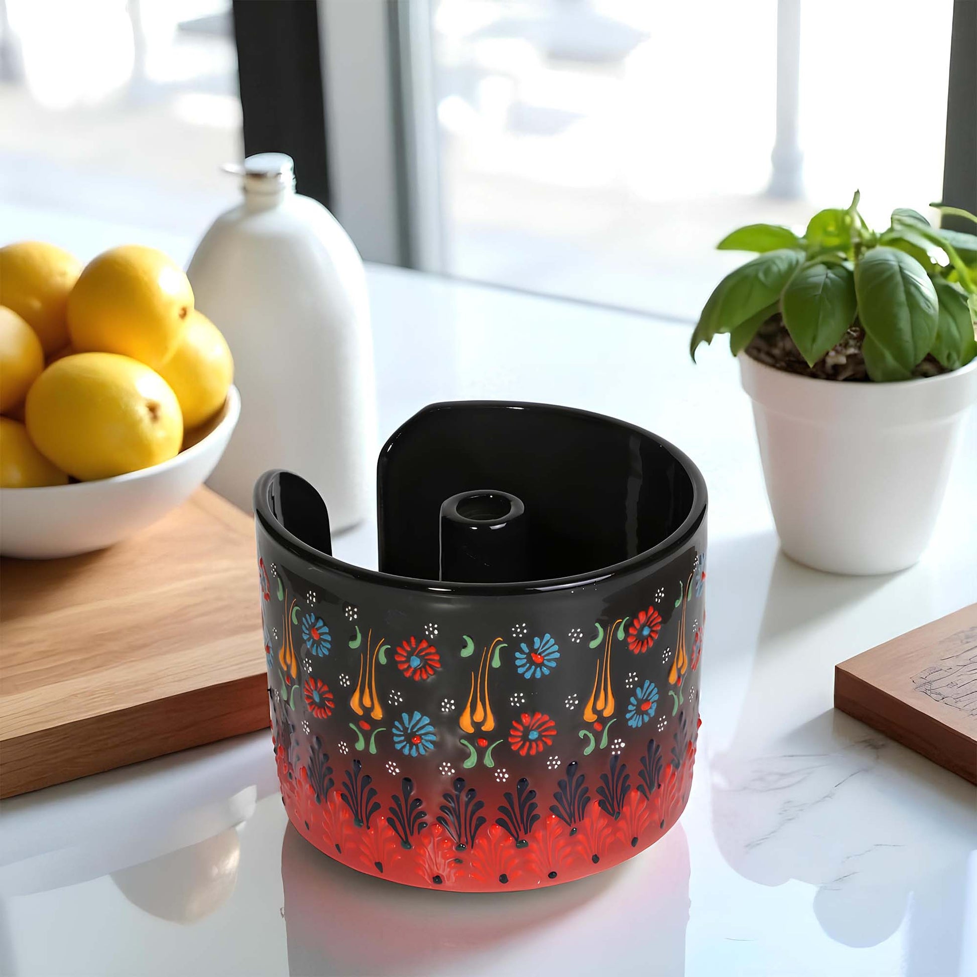 Decorative paper towel holder with floral pattern on a kitchen counter