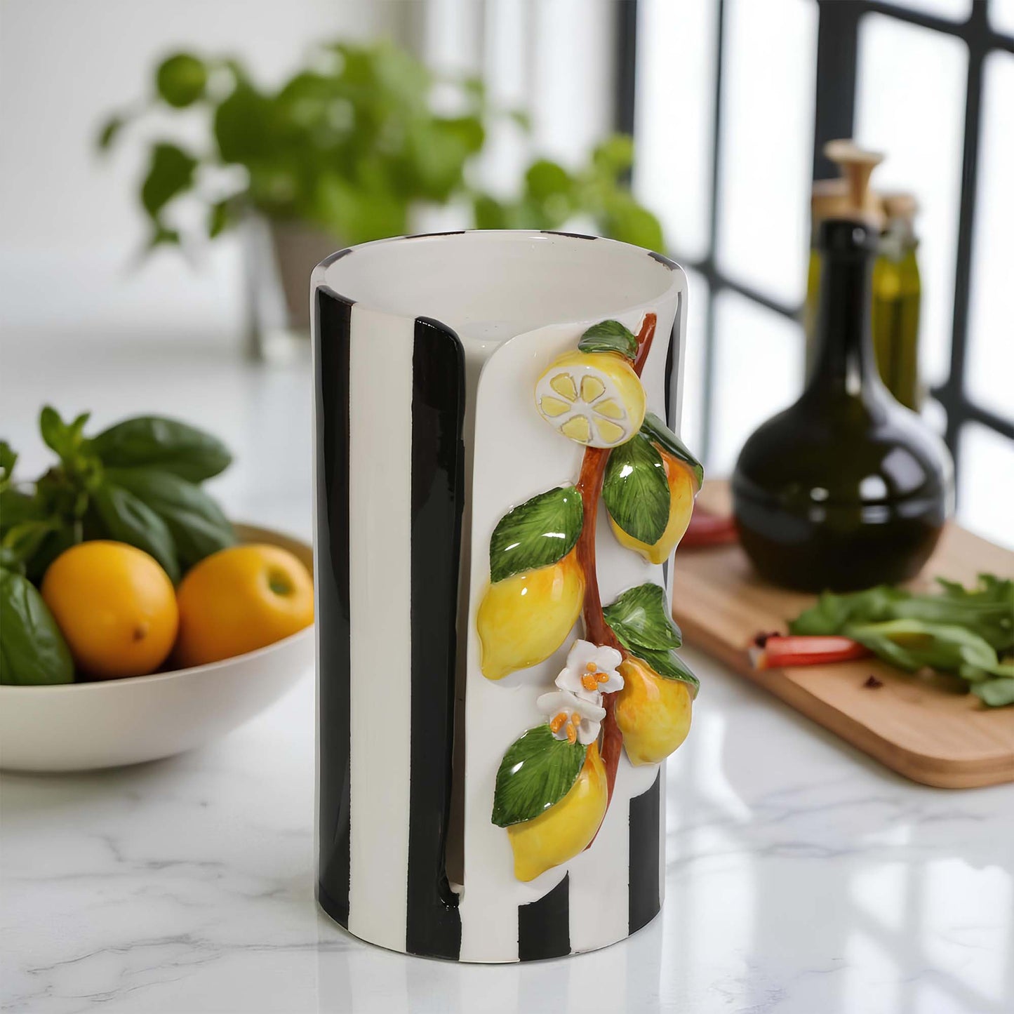 Decorative paper towel holder with lemon design on a kitchen counter