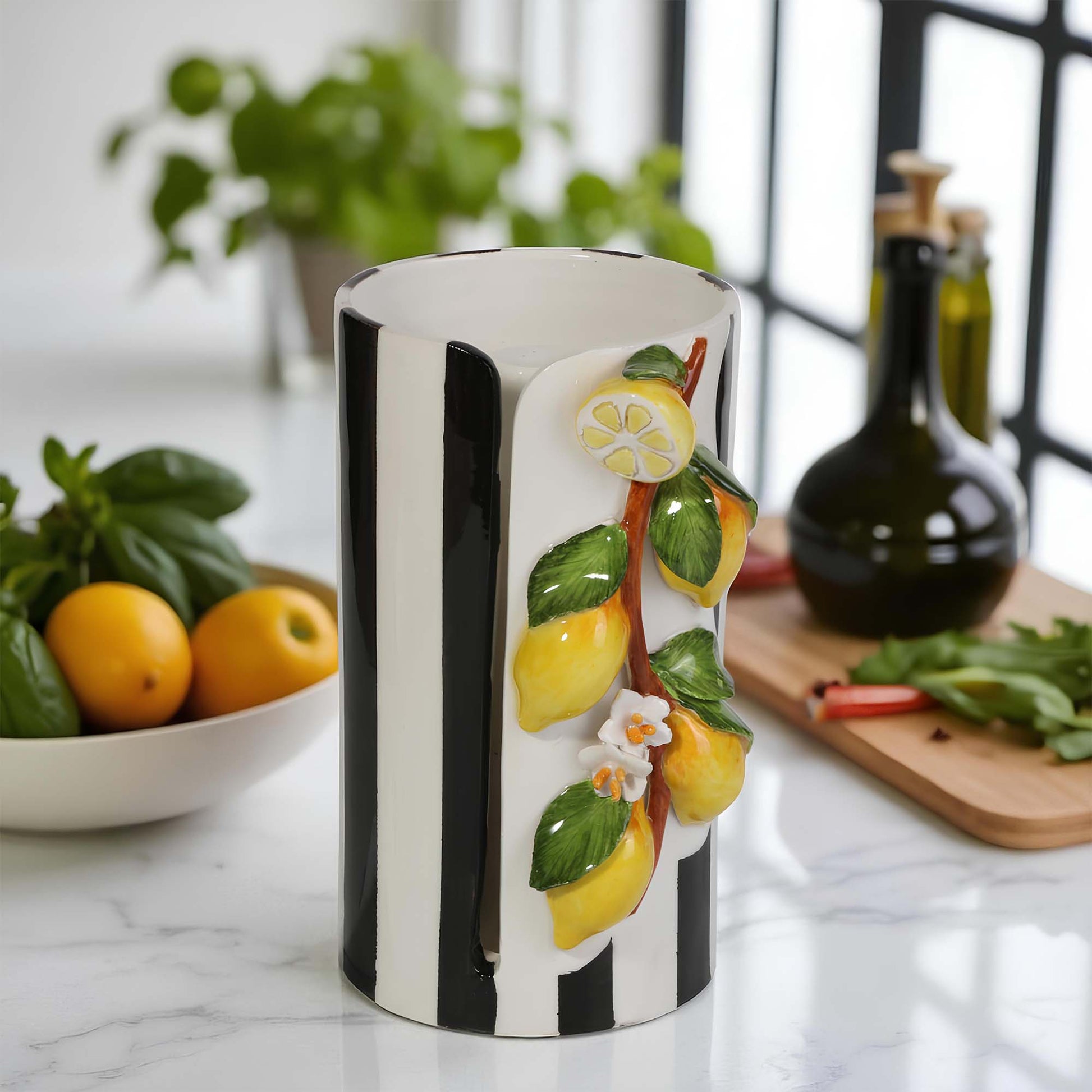 Decorative paper towel holder with lemon design on a kitchen counter