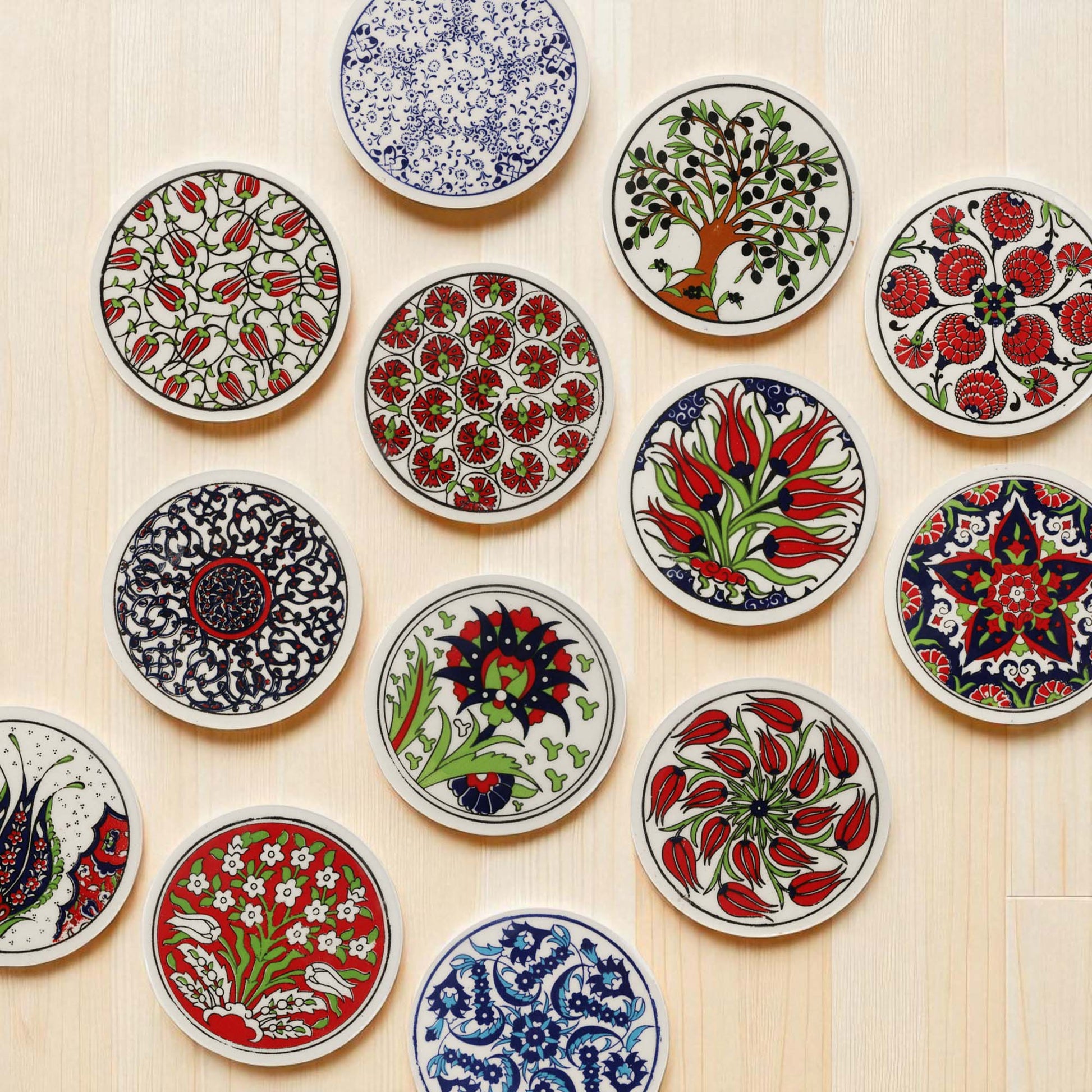 Collection of colorful ceramic coasters with intricate patterns on a wooden surface