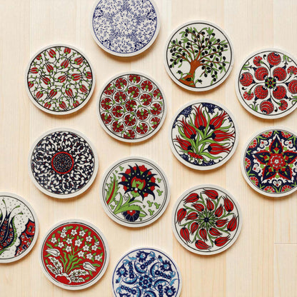 Collection of colorful ceramic coasters with intricate patterns on a wooden surface