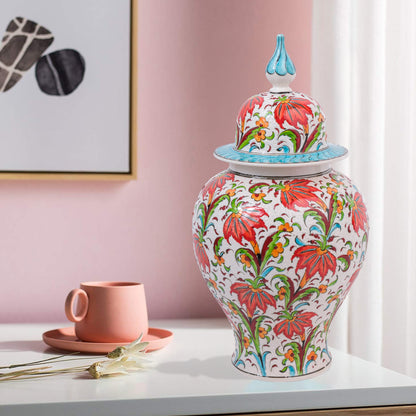 Hand-painted Tulip Garden ceramic jar with vivid red tulips, yellow blossoms & green foliage. Lidded artisan jar with turquoise finial, perfect décor or gift.