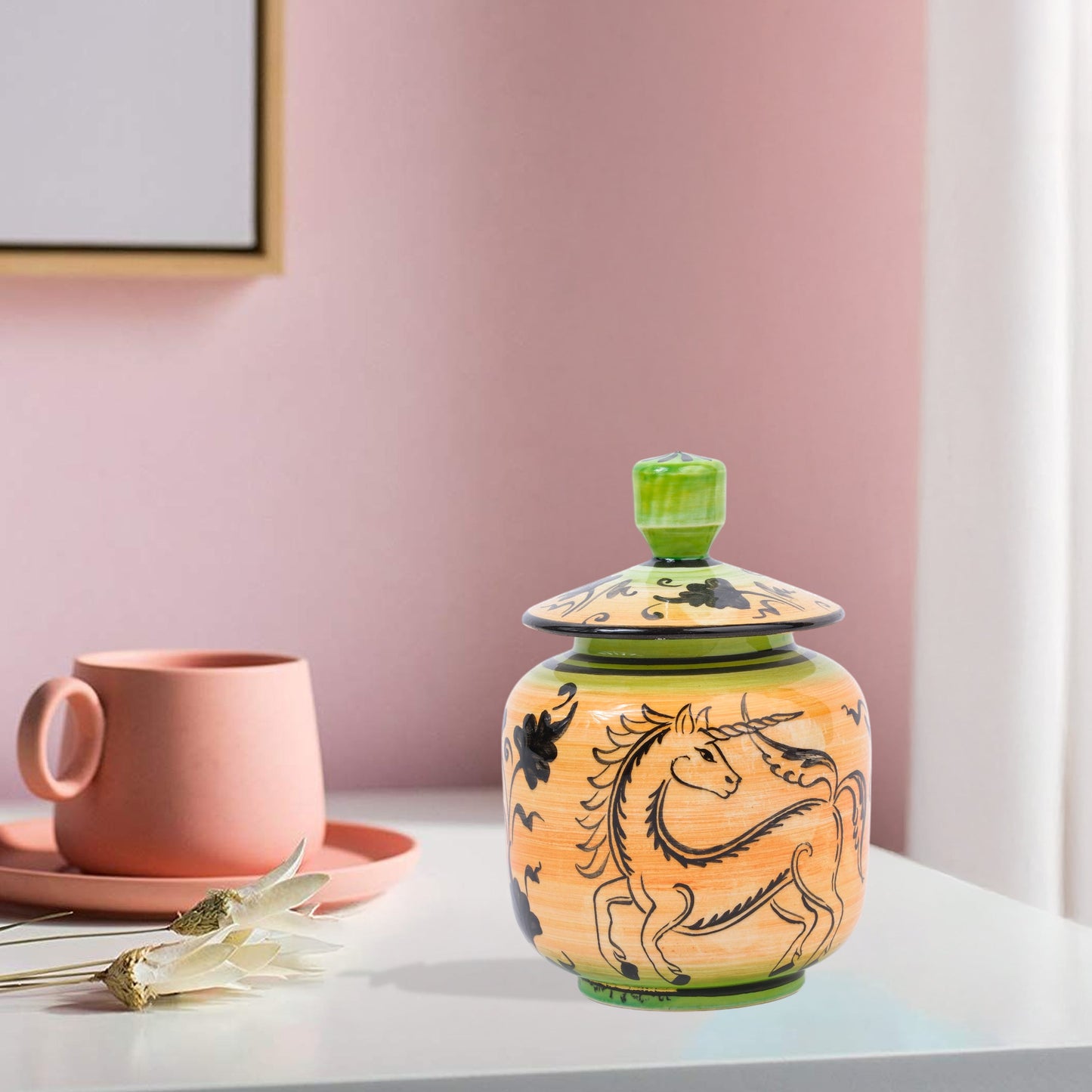 Hand-painted Unicorn Dance ceramic jar with whimsical black unicorn motif on orange & green. Lidded artisan jar, perfect for honey, ginger, spices, or décor.