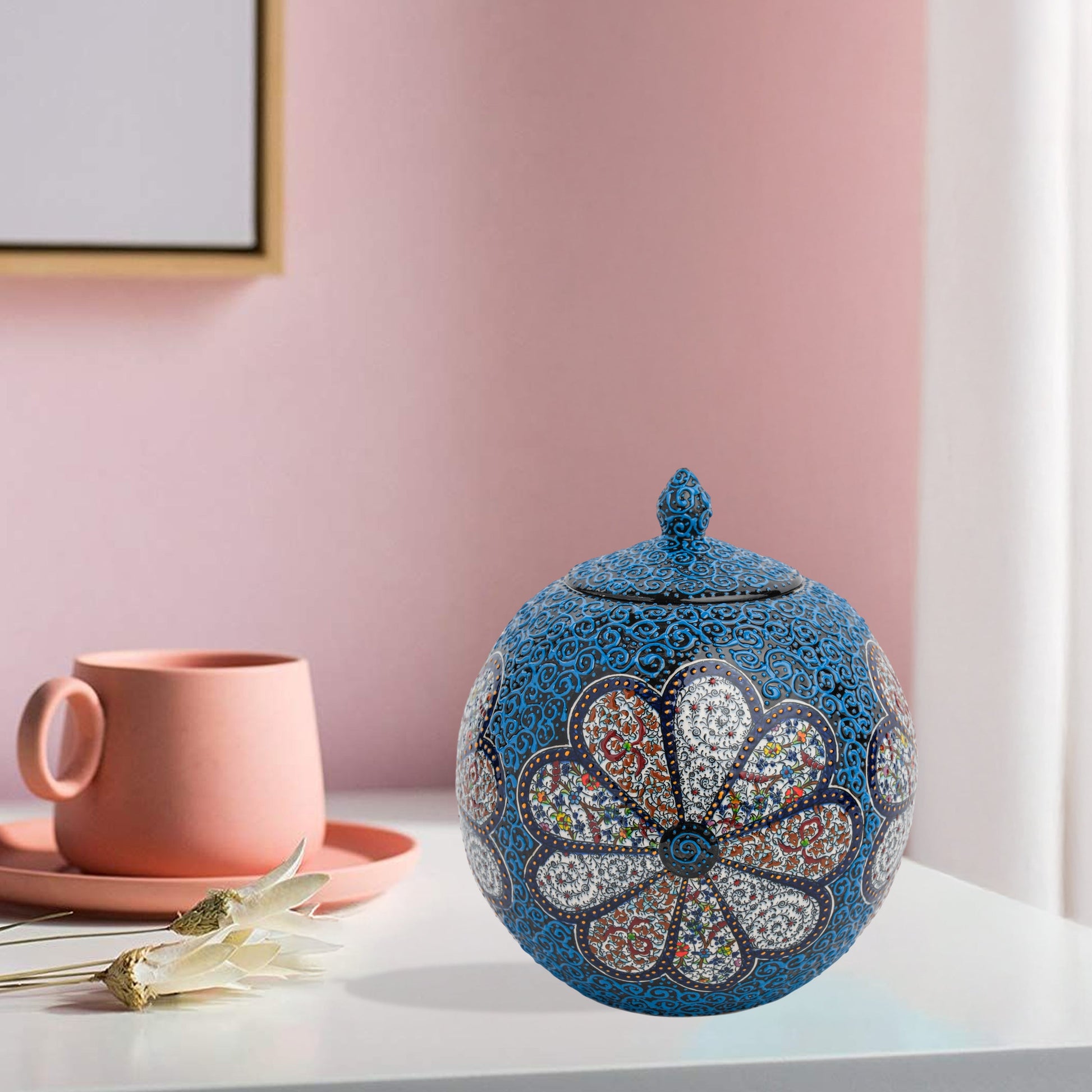 Hand-painted Blue Blossom globe jar with layered floral motifs and raised blue scrollwork. Spherical ceramic jar, artisan-made, perfect décor or gift.