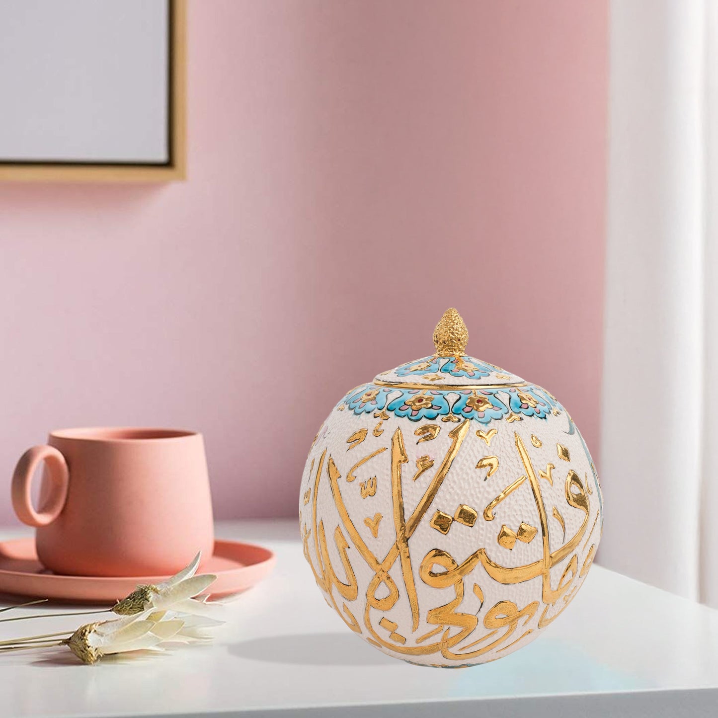 Hand-painted Gold Script globe jar with Arabic calligraphy in gold and turquoise floral trim. Spherical ceramic jar with gilded finial, perfect décor or gift.