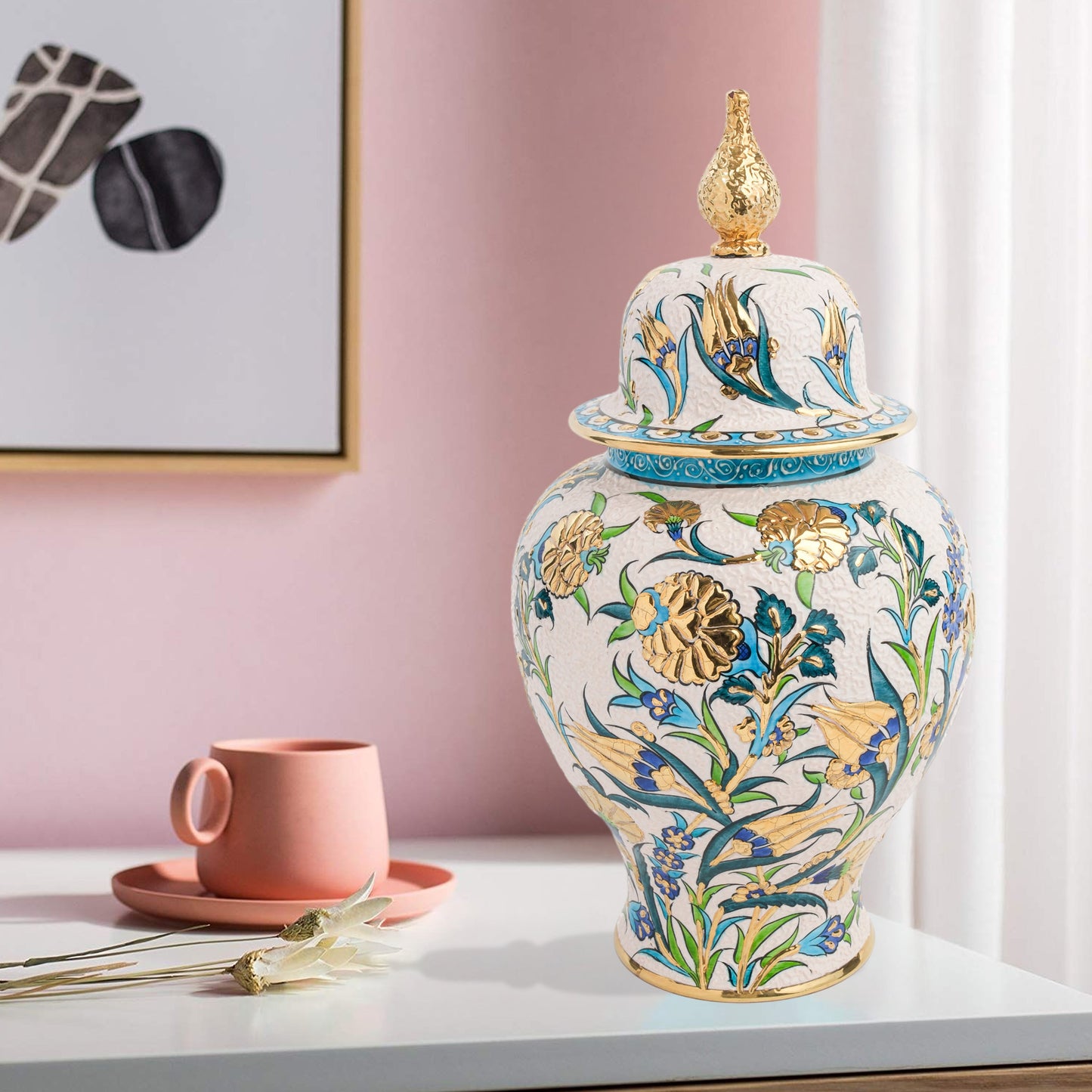 Hand-painted Golden Bloom ceramic jar with blue tulips, green leaves & gold accents. Finished with sculpted golden finial, artisan-made, perfect décor or gift.