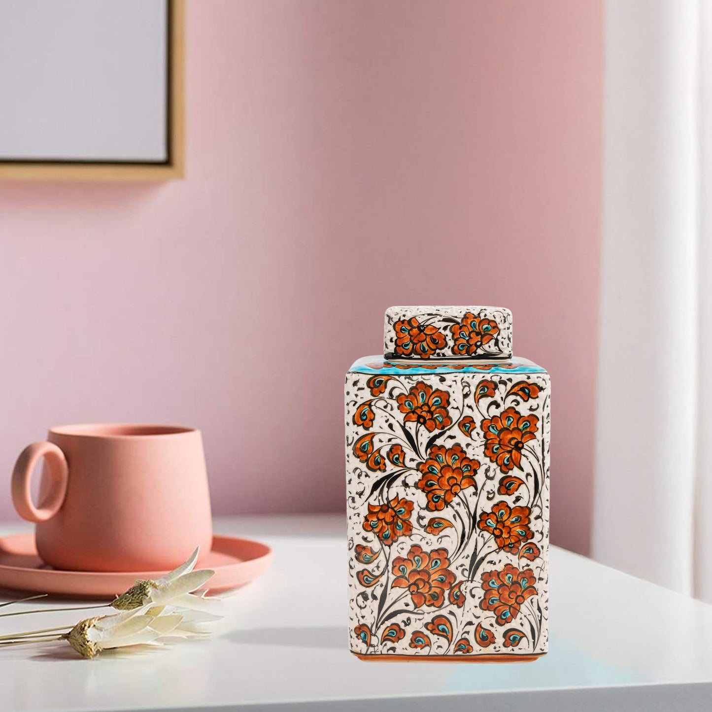 Hand-painted Terracotta Bloom ceramic jar with vivid orange floral motifs. Square lidded design, artisan-crafted, perfect for tea, spices, décor, or gifts.