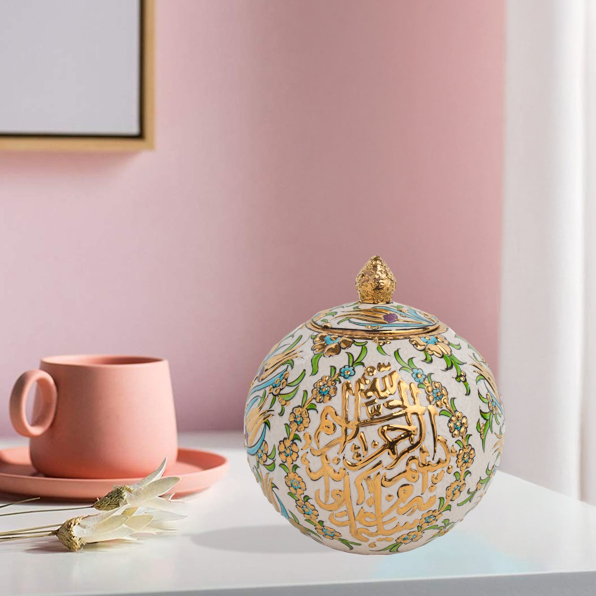 Hand-painted Floral Script globe jar with golden Arabic calligraphy and turquoise floral motifs. Spherical ceramic design, artisan-made, perfect décor or gift.